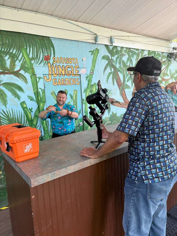 Shane being filmed by Felix, Grapevine videographer, at Sarasota Jungle Gardens.